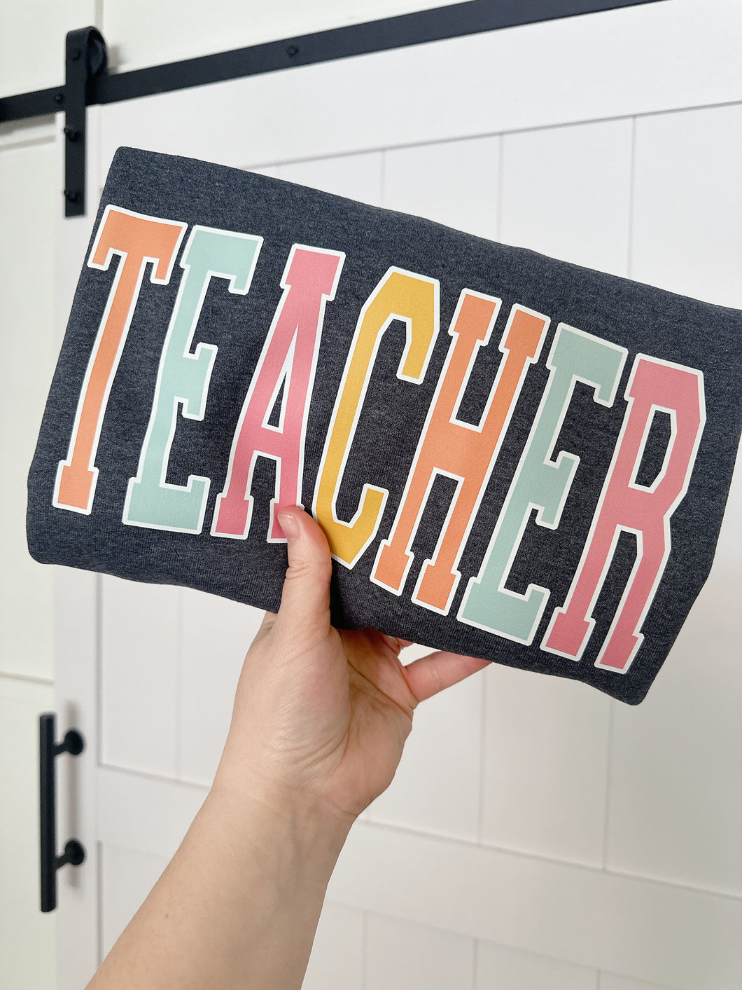 TEACHER RAINBOW VARSITY TEE