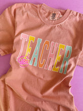 Load image into Gallery viewer, TEACHER RAINBOW VARSITY TEE
